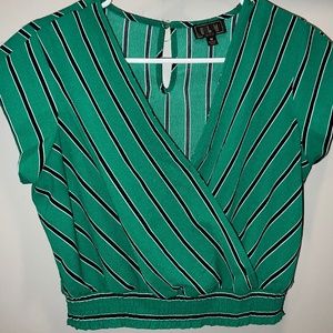 Green crop top with black/white stripes